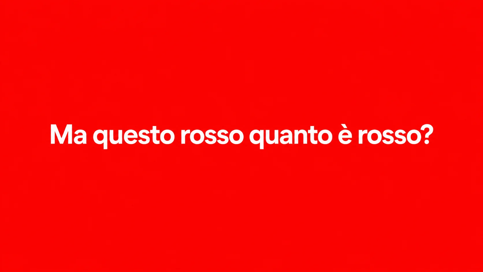 Sfondo rosso pieno con la scritta bianca «Ma questo rosso quanto è rosso?», il dubbio a cui risponde la prova colore